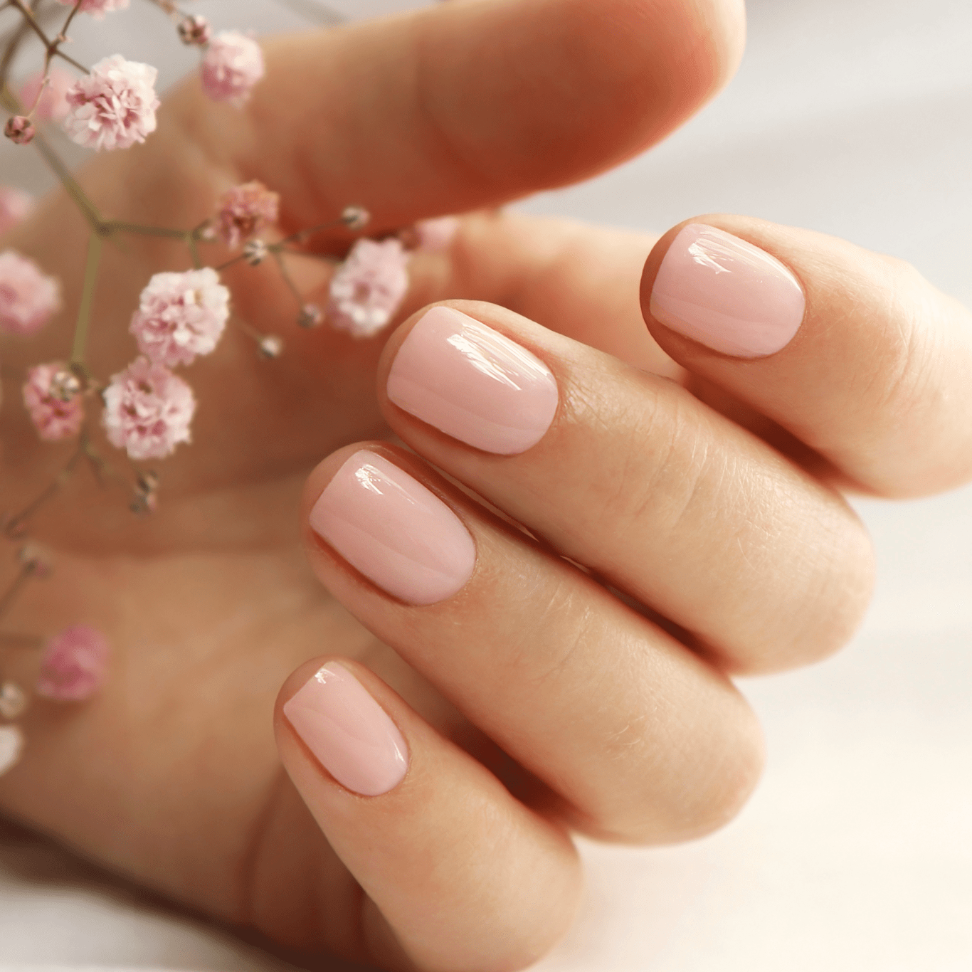 a hand with freshly done biab manicure